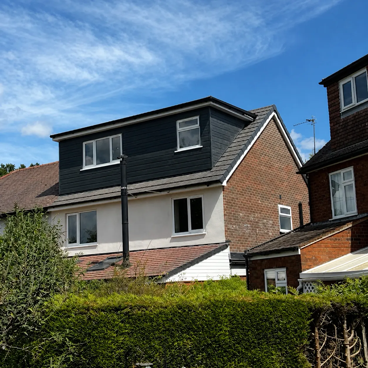 Dark-clad loft and extension project by Premier All Trades