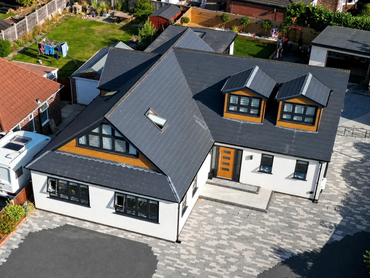 Aerial view of a completed white bungalow transformation by Premier All Trades